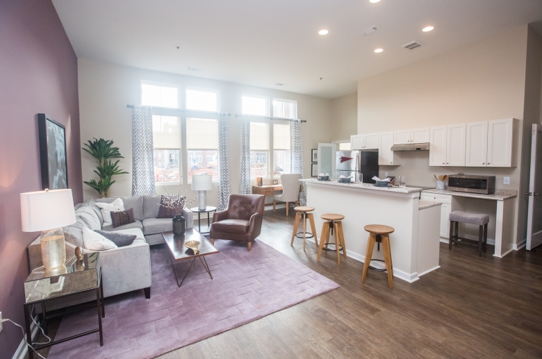 Open concept kitchen and living area with natural lighting