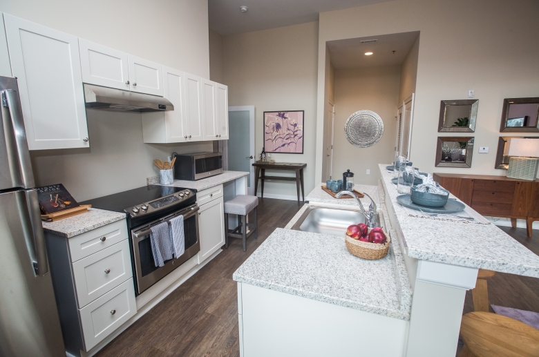 Kitchen with granite countertops and stainless steel appliances