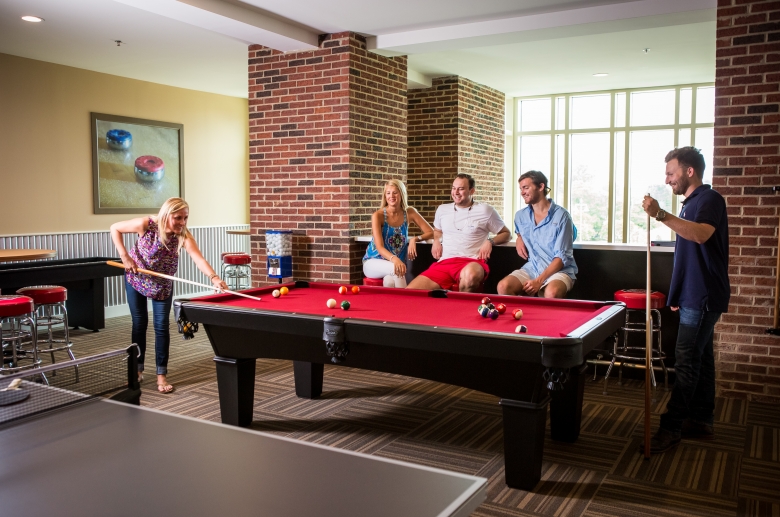 Lounge with pool table at 612 Whaley 