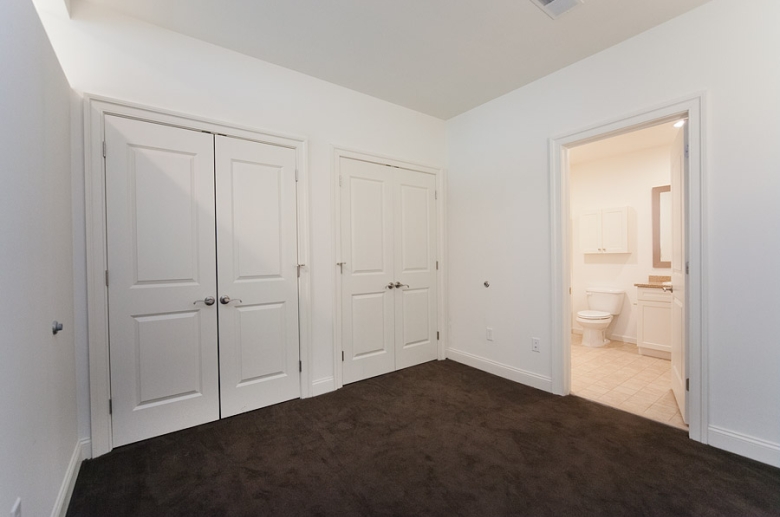 38 Crown Street master bedroom with ample storage space