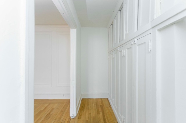 Built-in cabinetry and dressing space adjacent to bedroom