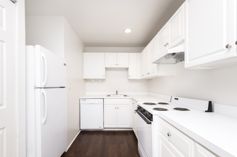 Modern kitchen featuring white appliances