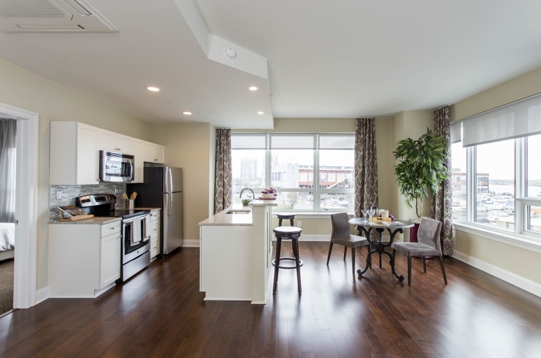 Open concept kitchen and dining areas at One Water Street 
