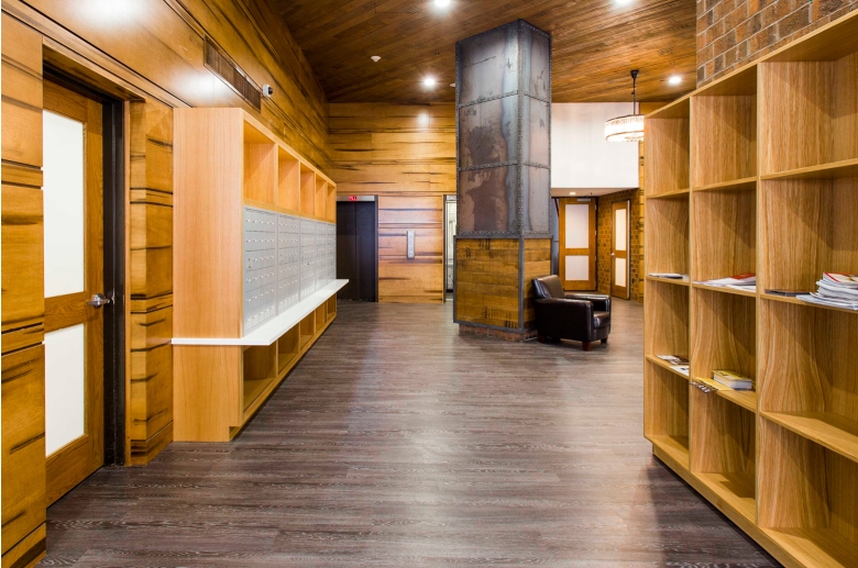 Barringer Residences lounge feature mailboxes, seating, and shelves