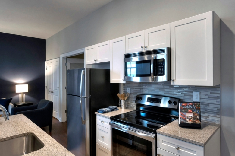 An open-concept kitchen at The Residences at The R. J. Reynolds Building