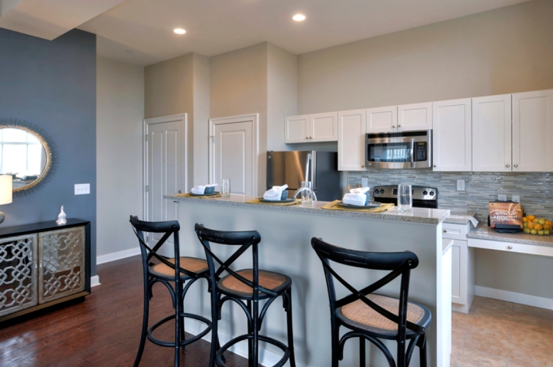 Kitchen and dining space with hardwood flooring