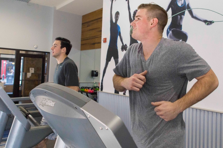 Barringer residents doing exercise on cardio equipment