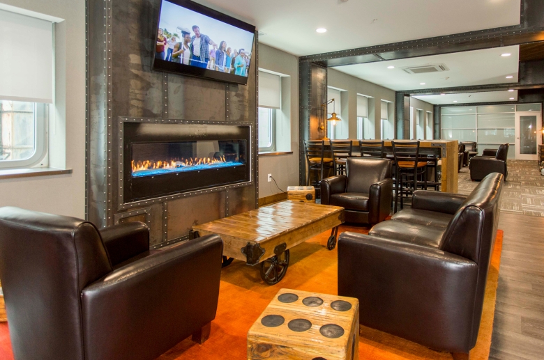 Resident lounge with gas fireplace and flatscreen TV