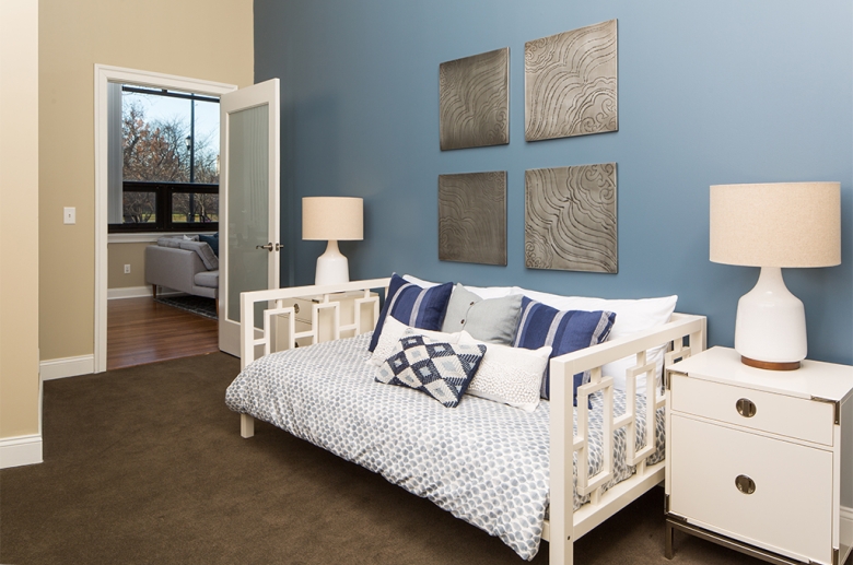 Bedroom with wall to wall carpeting