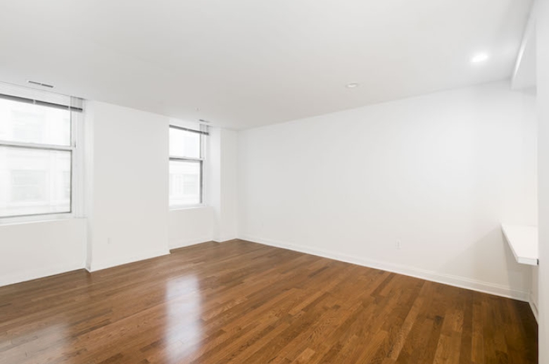 Dining space with gleaming hardwood floors