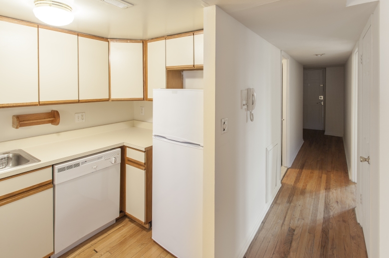 Hallway opening to kitchen