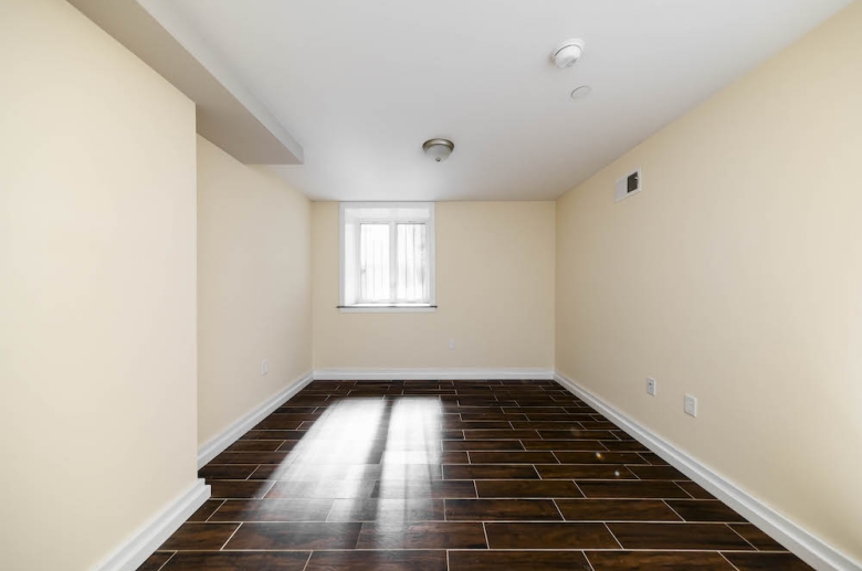 Bedroom with gleaming hardwood floors