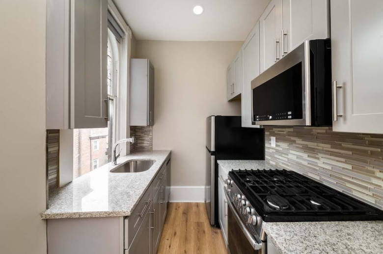 Galley kitchen with granite countertops