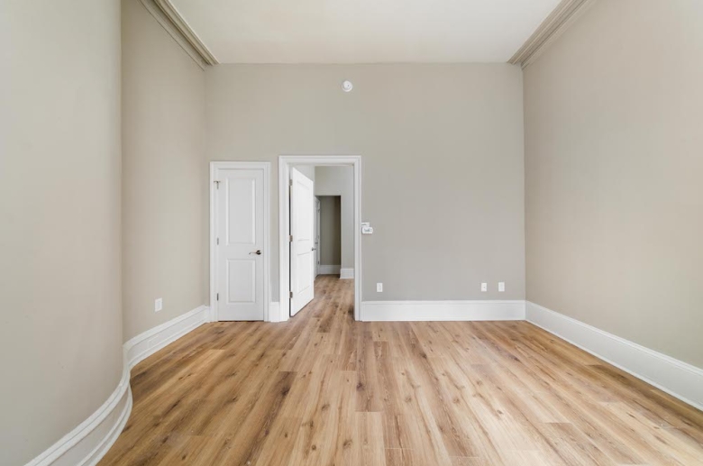 Bedroom with beautiful hardwood flooring