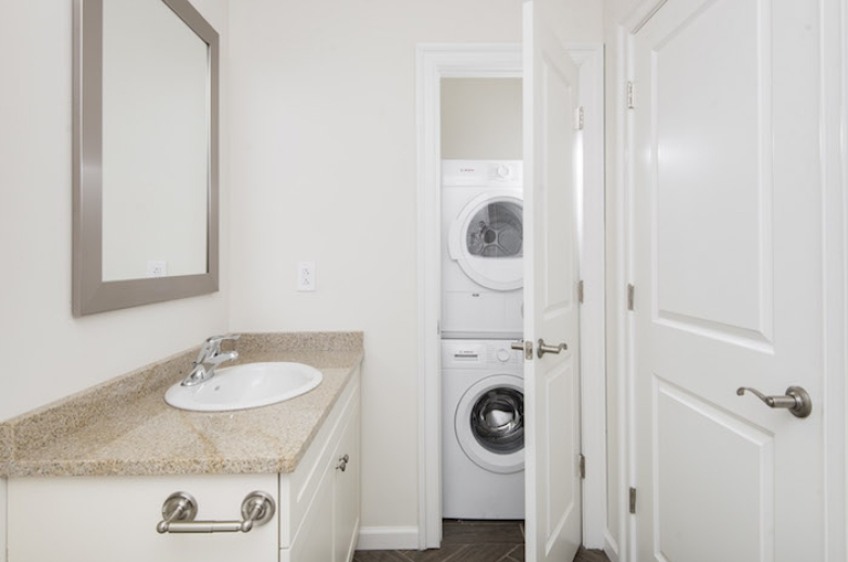 Bathroom with stacking laundry units