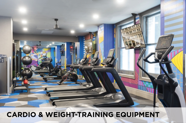 Cardio and weight-training equipment at Eight West Third Apartments