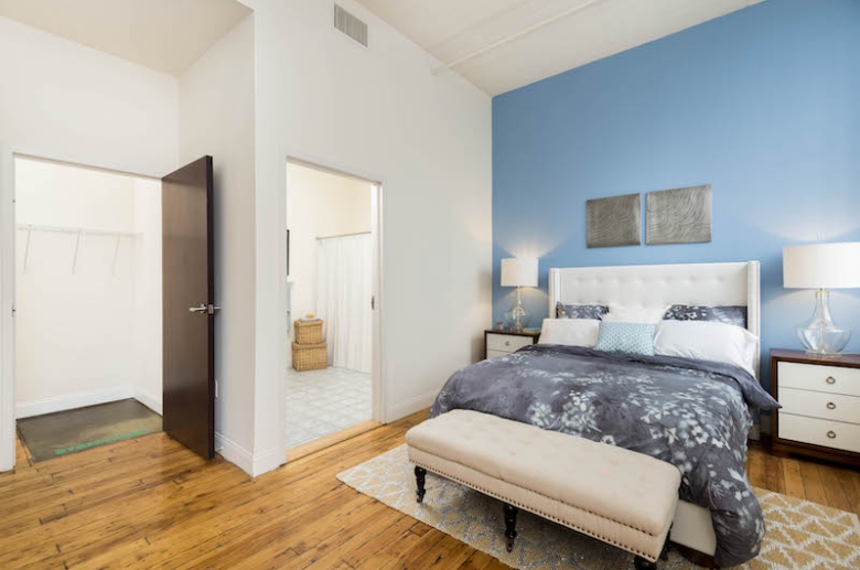 Bedroom with hardwood flooring