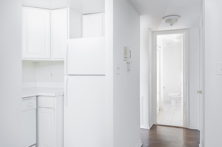 Kitchen and common spaces with hardwood flooring