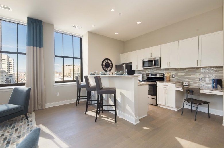 Kitchen featuring modern tile backsplash at One Water Street