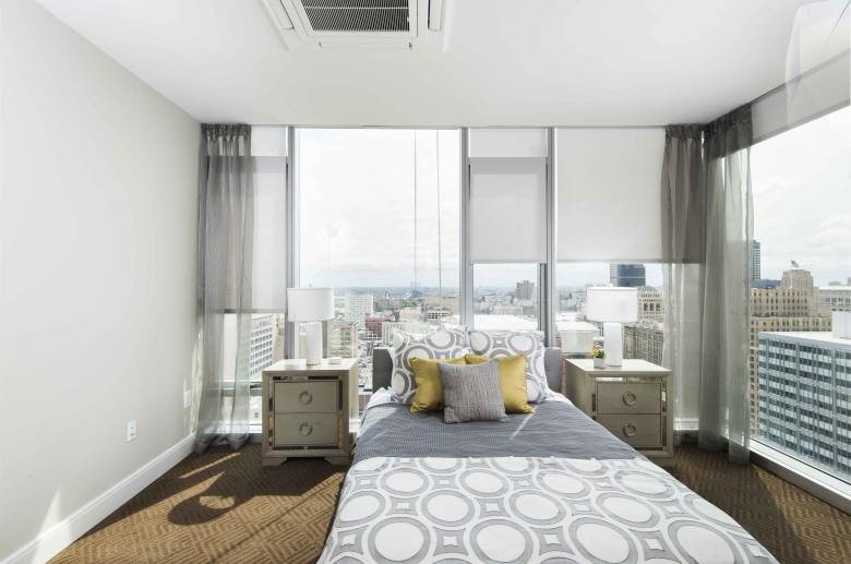 Bedroom with panoramic city views