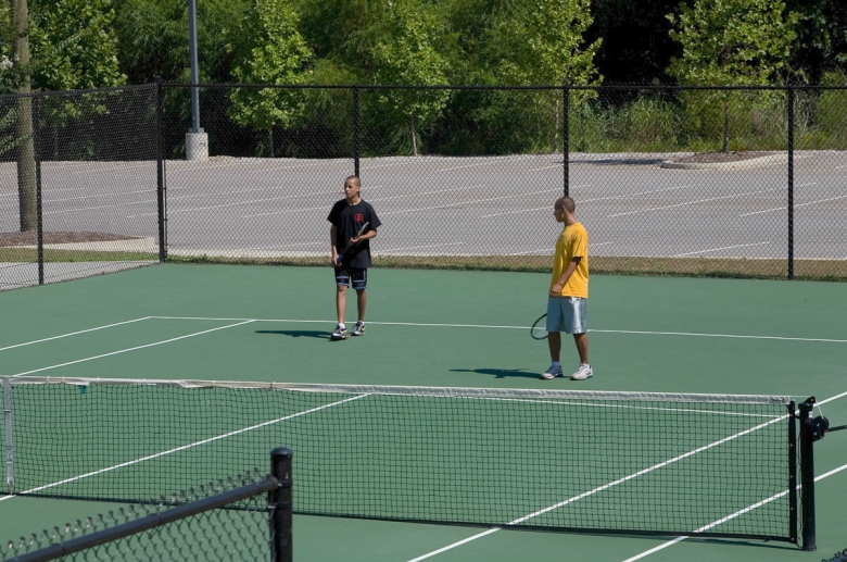 Granby Mills outside tennis court