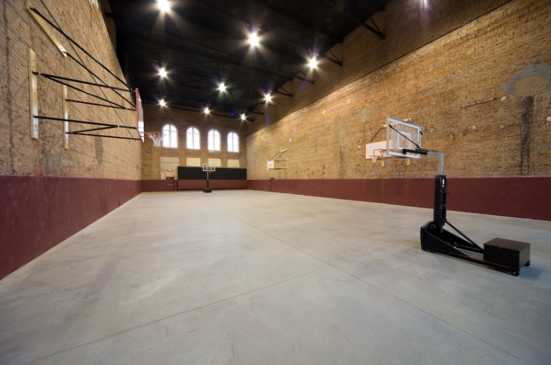In-door basketball court with multiple sized baskets