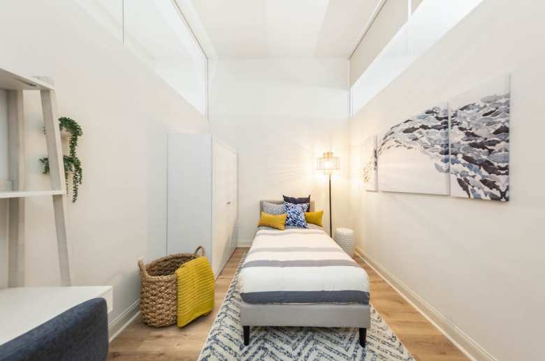 Bedroom with hardwood flooring