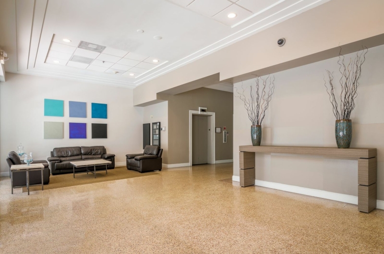 Atrium lobby with seating and a view to the elevators