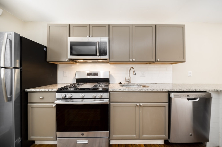 415-417 S. 10th Street kitchen featuring granite countertops and stainless steel appliances