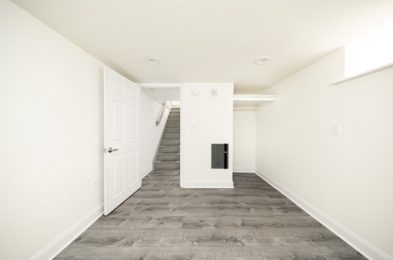 Dark floor bedroom contrasting white walls