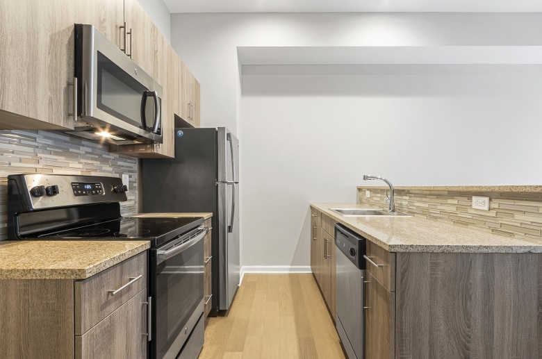 Steel appliances and granite countertops at 1300 Chestnut Street kitchen