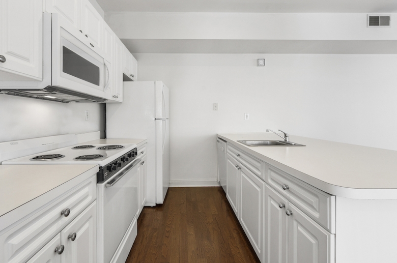 Kitchen featuring white appliances 