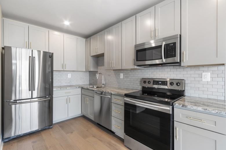 Stainless steel appliances and tile backsplash