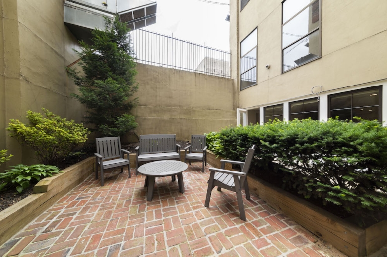 Outdoor common space with table and seating