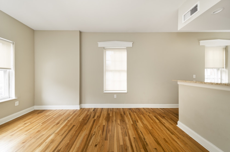 Dining and living space with hardwood flooring