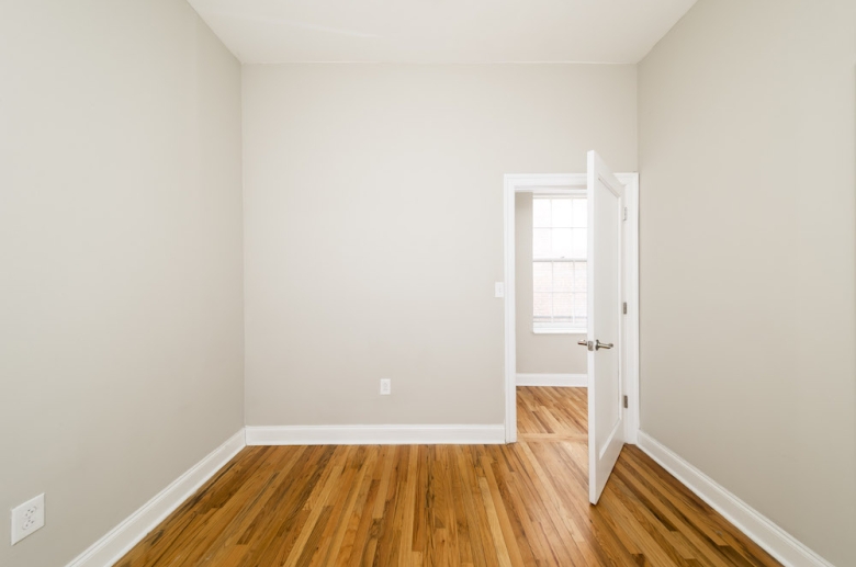 bedroom with hardwood flooring