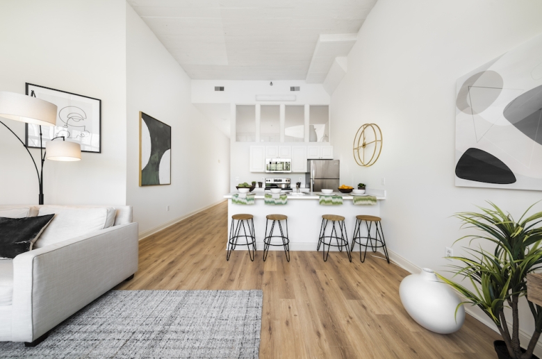 kitchen & living space with hardwood flooring