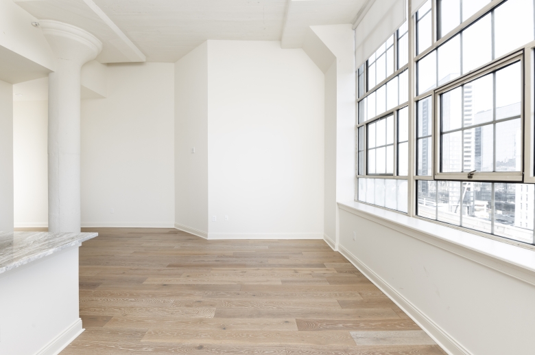 Architectural elements include high ceilings and kitchen columns at 2121 Market Street