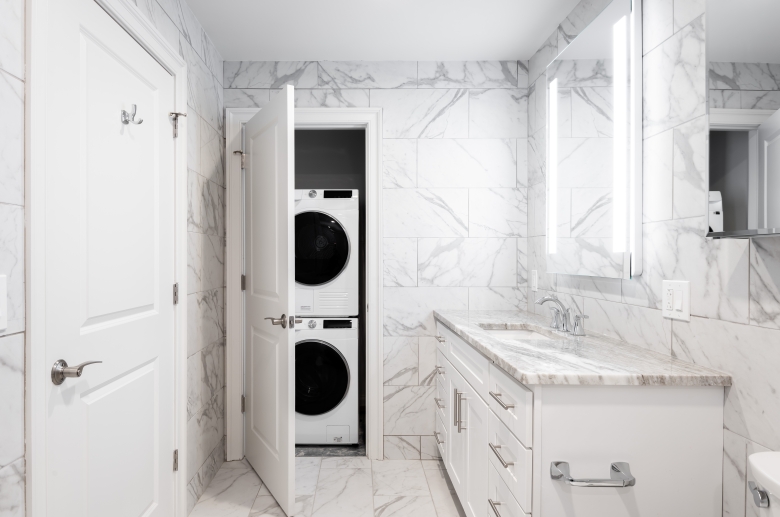 Bath featuring stackable washer & dryer unit