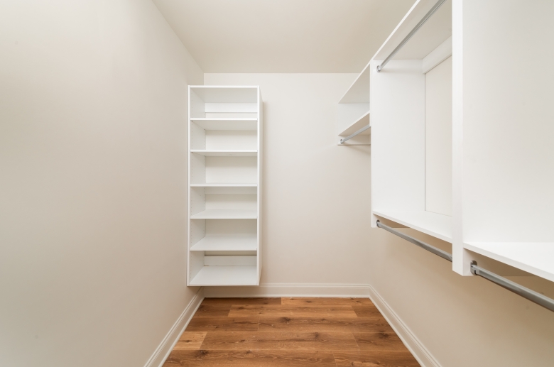 Walk-in closet with built-in shelving at 2121 Market