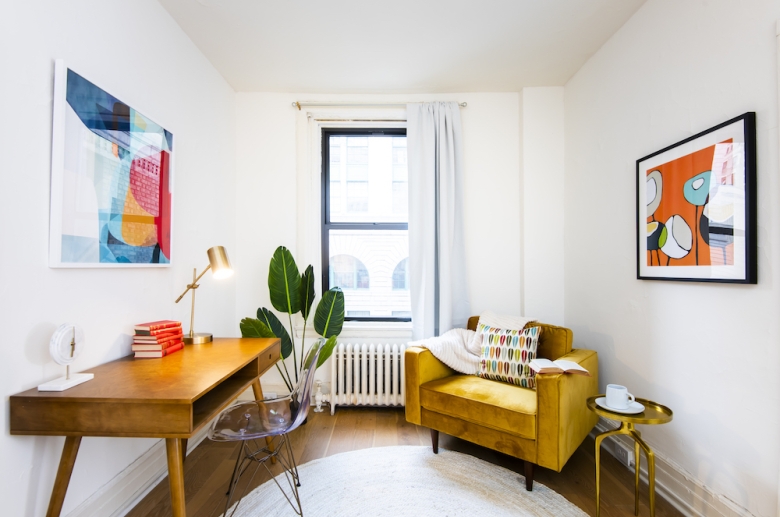 Sitting room or office with hardwood flooring and natural lightning