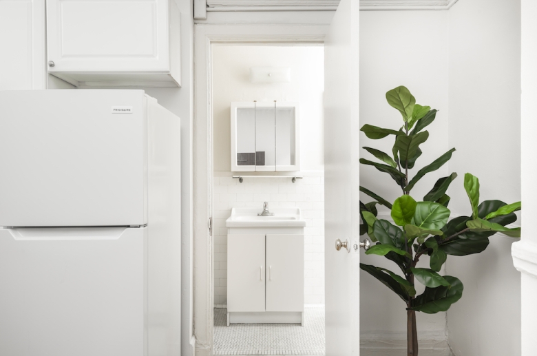 A view of the bathroom entrance from the kitchen