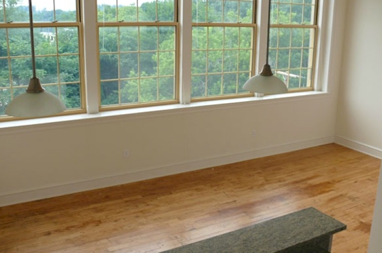 dining space with hardwood flooring
