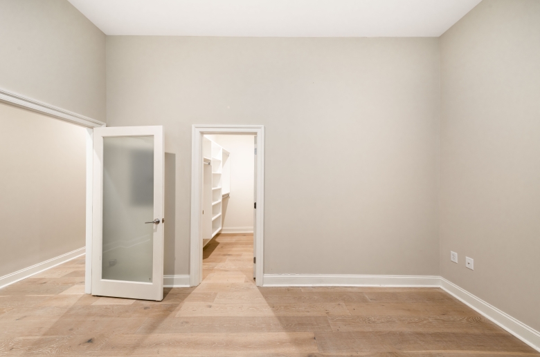 Bedroom with walk-in closet