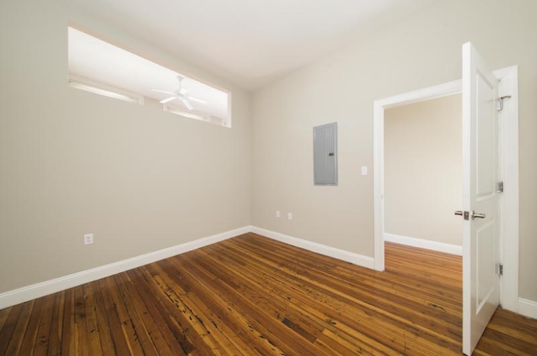 Bedroom with hardwood flooring