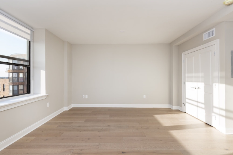 Bedroom with hardwood flooring