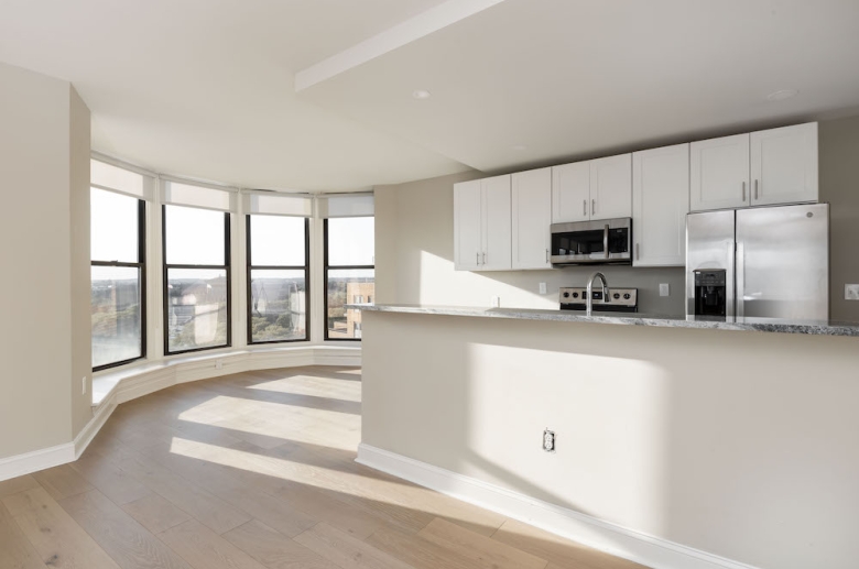 Breakfast bar with waterfall granite countertop