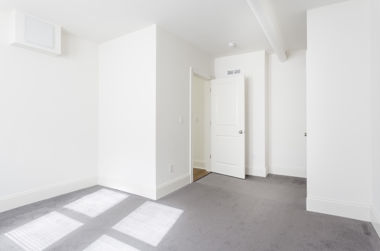 Bedroom with wall to wall carpeting