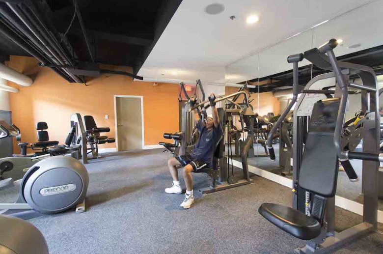 Fully-equipped fitness center at Adelphia House