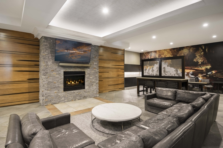 The Warehouse Apartments lounge with gas fireplace